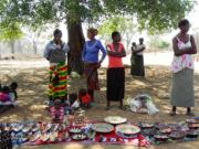 The local wives display their wares for sale